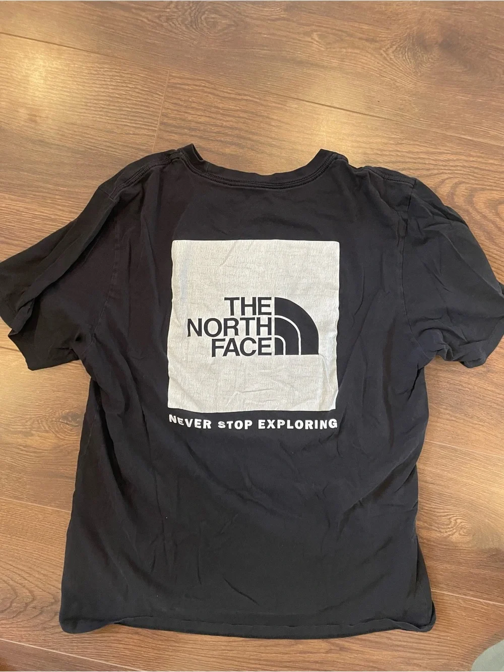 The North Face Black Graphic Tee - 'Never Stop Exploring'